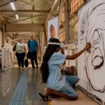 Instituto EUMELANINA leva exposição “Mulheres em Foco” e Live Painting ao Agosto Lilás no Metrô de Salvador